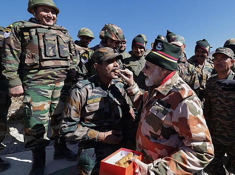 Prime Minister Narendra Modi celebrates Diwali with security personnel, in Lepcha, Himachal Pradesh, Sunday, Nov. 12, 2023. (PTI)