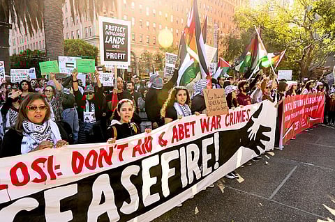 Demonstrators march in opposition to the APEC Summit on Sunday, November 12, 2023, in San Francisco. (Photo | AP)