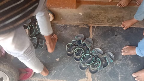 Students wear chappals at a government school in Lakshmeshwar. (Photo | Express)