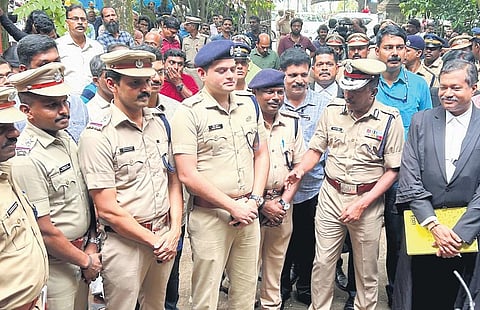Police team that probed the case interacts with ADGP M R Ajith Kumar, Ernakulam Rural police chief Vivek Kumar and special public prosecutor G Mohanraj at the court in Kochi on Tuesday | Express