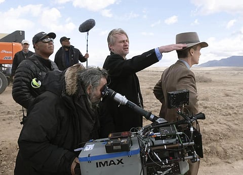 Director Christopher Nolan, centre, with actor Cillian Murphy on the sets of 'Oppenheimer'. (AP)