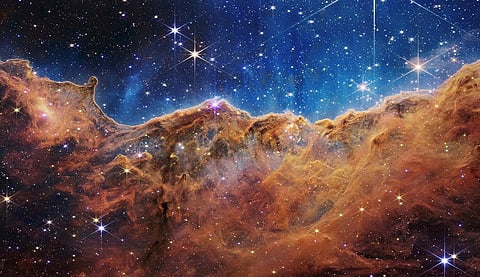 The 'Cosmic Cliffs' of the Carina Nebula are seen in an image released by NASA on July 12, 2022.