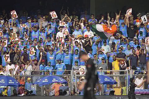 Spectators cheer for India during the World Cup semi final match between India and New Zealand in Mumbai (Photo | AP)