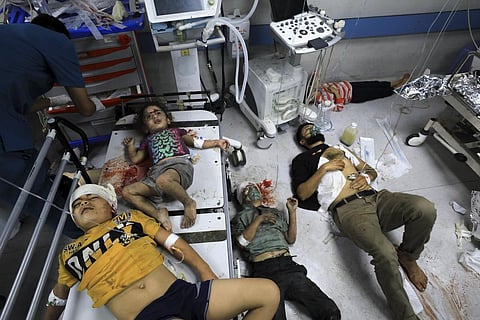 Palestinians wounded in the Israeli bombardment wait for treatment in Shifa Hospital in Gaza City, Monday, Oct. 23, 2023. (Photo | AP)