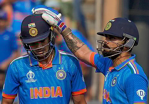 India's Virat Kohli greets Shubman Gill as he celebrates scoring fifty runs during the ICC Men's Cricket World Cup 2023 semi-final match between India and New Zealand on Nov. 15, 2023. (Photo | PTI)