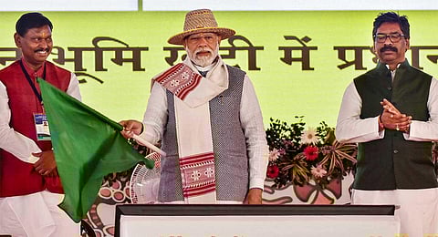 PM Narendra Modi with Jharkhand CM Hemant Soren and Union Tribal Affairs Minister Arjun Munda flags off various development projects in Khunti, Jharkhand, Wednesday, Nov. 15, 2023. (PTI)