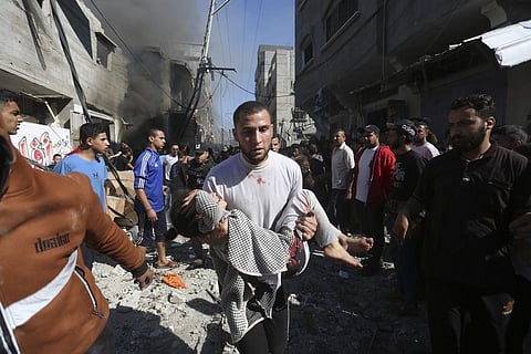 Palestinians rescue survivors after an Israeli strike on Rafah, Gaza Strip, Friday, Nov. 17, 2023. (Photo | AP)