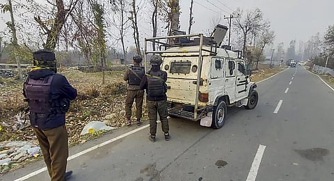 Security personnel stand guard during an encounter with militants, in Kulgam, on Thursday, November 16, 2023. (Photo | PTI)