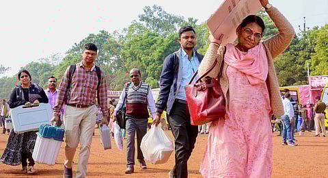 Polling officials with EVMs and other election material leave for poll duty ahead of Madhya Pradesh Assembly elections, in Bhopal, Thursday, Nov. 16, 2023. (PTI)