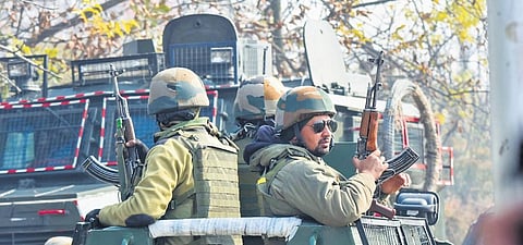 Security personnel keep vigil in Nehama village of Kulgam district on Friday | pti