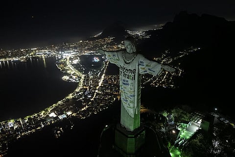 The Christ the Redeemer statue is illuminated with a welcome message for American singer Taylor Swift in Rio de Janeiro (Photo | AP)
