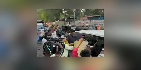 A video capturing the incident depicting police intervention to rescue Jadhav amidst slogans raised by Pawar's supporters. (Photo | ANI Twitter)