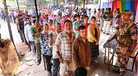 FILE: Voters wait in queues at a polling station to cast their votes for the Madhya Pradesh Assembly elections. (Photo | PTI)