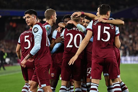 West Ham's players celebrate their first goal during the English League Cup fourth round football match between West Ham United and Arsenal. (Photo | AFP)