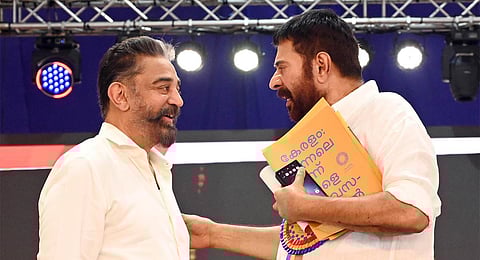 Actors Kamal Haasan and Mammootty share a light moment on the stage. (Photo | Vincent Pulickal)