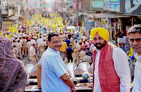 Delhi Chief Minister Arvind Kejriwal and Punjab Chief Minister Bagwant Mann during a roadshow ahead of the Assembly elections, in Singrauli, Madhya Pradesh, Thursday, Nov. 2, 2023. (PTI)