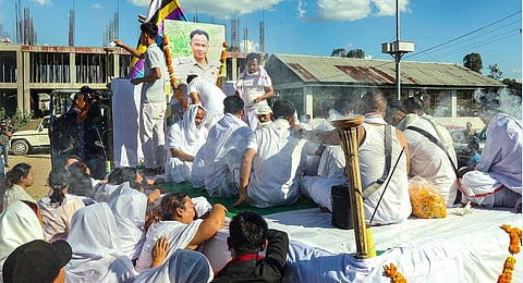 Family members and relatives mourn near the body of slained Manipur cop Ch. Anand Kumar, who was killed Tuesday in an ambush by militants, in Imphal, Wednesday, Nov. 1, 2023. (PTI )