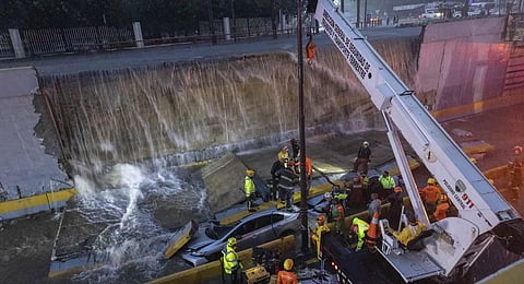 Rescue teams work at the place where a wall collapsed at the entrance of a tunnel in Santo Domingo, Dominican Republic. (Photo | AP)