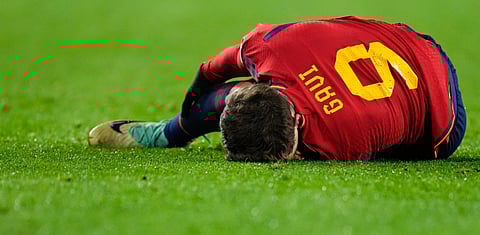 Spain's Gavi reacts after injuring his leg during the Euro 2024 group A qualifying soccer match between Spain and Georgia. (Photo | AP)