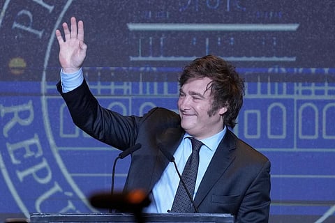Presidential candidate of the Liberty Advances coalition Javier Milei waves during his victory speech after being elected president in a runoff election in Buenos Aires, Nov. 19, 2023. (Photo | AP)