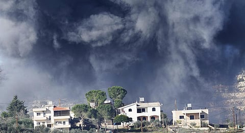 Black smoke rises from an Israeli airstrike on the outskirts of Aita al-Shaab, a Lebanese border village with Israel.(Photo | AP)