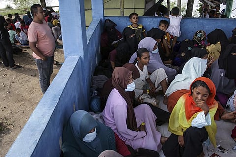 Newly-arrived ethnic Rohingya women, part of a group who was denied landing a few times by local residents, rest at a temporary shelter in Bireun, Aceh province, Indonesia Monday, Nov. 20, 2023. (AP)