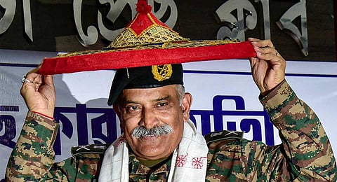 Eastern Command General Officer Commanding-in-Chief Lt Gen Rana Pratap Kalita felicitated with a 'japi' during a 'Guest of the Month' programme of Guwahati Press Club, Tuesday, Nov. 21, 2023. (PTI)