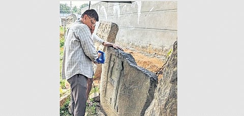 Udaya Kumar scans one of the inscriptions dotting Bengaluru. (Photo | Special arrangement)