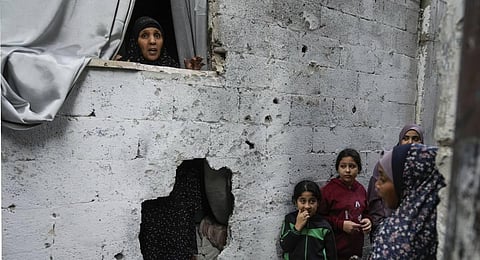 Palestinians inspect the site of an Israeli strike after a military raid in the town of Tulkarem, West Bank. (Photo | AP)