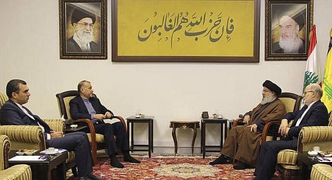 In this picture released by the Iranian Foreign Ministry on Nov. 23, 2023, Iran's Foreign Minister second left, speaks with Lebanese Hezbollah leader Sayyed Hassan Nasrallah, second right.(AP)