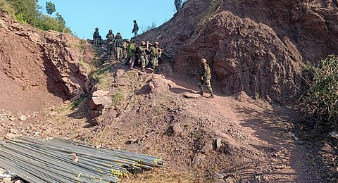 Army personnel and locals carry the body of an army officer near the site of an encounter with terrorists at Kalakote area, in Rajouri district. (Photo | PTI)