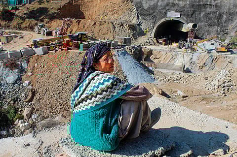 A local looks at the ongoing rescue operation to evacuate the 41 workers trapped in the under-construction tunnel in Uttarkhand | PTI