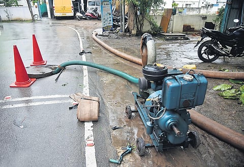 Following complaints of sewage overflow, metro water staff draining sewage water sewage manhole into a stormwater drain near TVS Nagar in Korattur | P Ravikumar