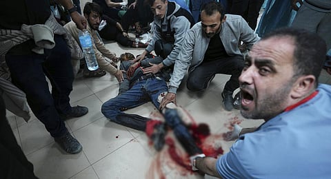 Palestinians wounded by the Israeli army as they tried to cross back to the northern Gaza Strip are treated in al Aqsa Hospital in Deir al Balah on Friday Nov. 24, 2023.(Photo | AP)