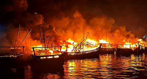 Flames and smoke rise after a fire broke out in a jetty area, in Visakhapatnam, early Monday, Nov. 20, 2023.(Photo | PTI)