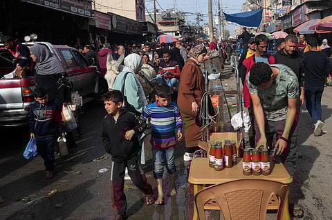 Palestinians visit an open-air market in Nusseirat refugee camp, central Gaza Strip, on Saturday, Nov. 25, 2023. on the second day of the temporary ceasefire between Hamas and Israel. (Photo | AP)
