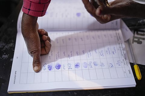 A voter puts his thumb impression before casting his vote in Ajmer, Rajasthan. (Photo | PTI)