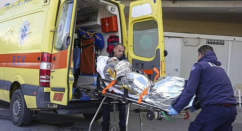 Paramedics transfer a survivor of a shipwreck at a hospital, on the northeastern Aegean Sea island of Lesbos, Greece. (Photo | AP)