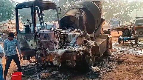 Wreckage of vehicles and machines, that were engaged in construction works, after Naxalites set them on fire, in Chhattisgarh's Dantewada district, on Nov. 27, 2023. (PTI)