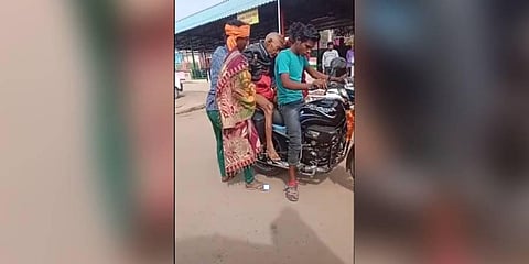 The video shows the body placed between two riders being transported on a motorcycle. (Photo | Twitter)