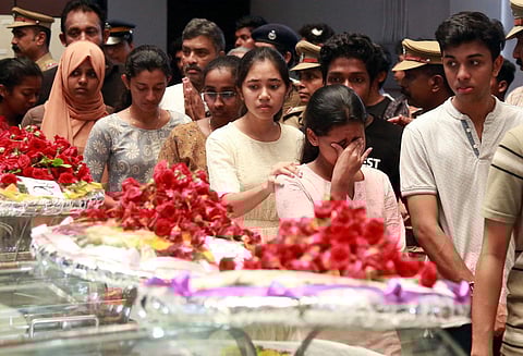 Students break down when the bodies of the three students were brought to the School of Engineering building at Cusat for people to pay homage on Sunday. (Photo | T P Sooraj)