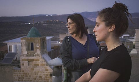This image released by Beall Productions shows Palestinian actress Hiam Abbass, left, and Lina Soualem in a scene from the documentary “Bye Bye Tiberias.” (Photo | AP)