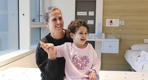 Released Palestinian prisoner Muhammad Abu Al-Humus, 17, hugs his mother after arriving home in east Jerusalem. (Photo | AP)