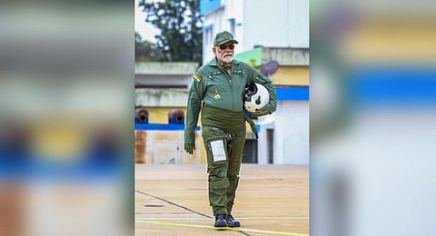 PM Narendra Modi in full aviator gear walks up to Tejas before his sortie in Bengaluru on Saturday | Express