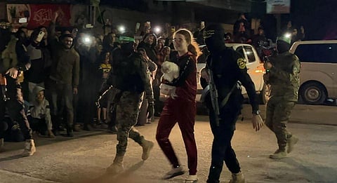 Teenager Mia Leimberg was released from captivity in Gaza clutching her pet dog Bella. (Photo | AFP)