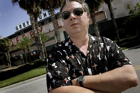 FILE - Author Tim Dorsey poses at the Derby Lane Greyhound Track in St. Petersburg, Fla., on Sept. 5, 2007. (Photo | AP)