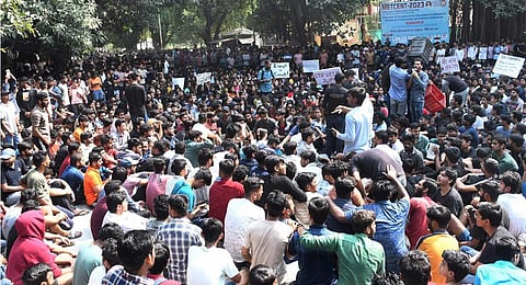 Students protesting outside the Indian Institute of Technology's (BHU) director’s office after a student alleged that she was molested on campus on Wednesday night, in Varanasi on Nov. 2, 2023. (PTI)