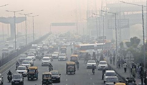 Vehicles ply on a busy stretch amid low visibility due to smog in Ghaziabad on Thursday. (Photo | PTI)