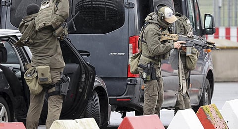 Heavily armed special police forces prepare for an operation at the airport, in Hamburg, Germany, Sunday, Nov. 5, 2023.(Photo | AP)