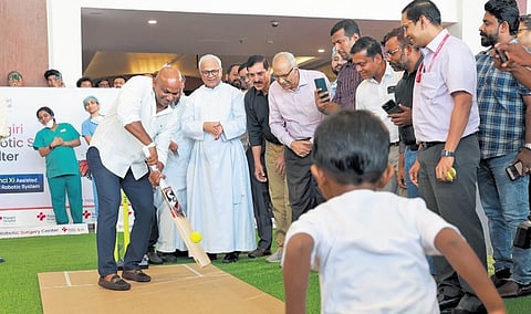 4-year-old Jovito bowls to Sri Lankan cricket legend Sanath Jayasuriya. Jovito is the first child to undergo paediatric robotic surgery at Rajagiri Hospital